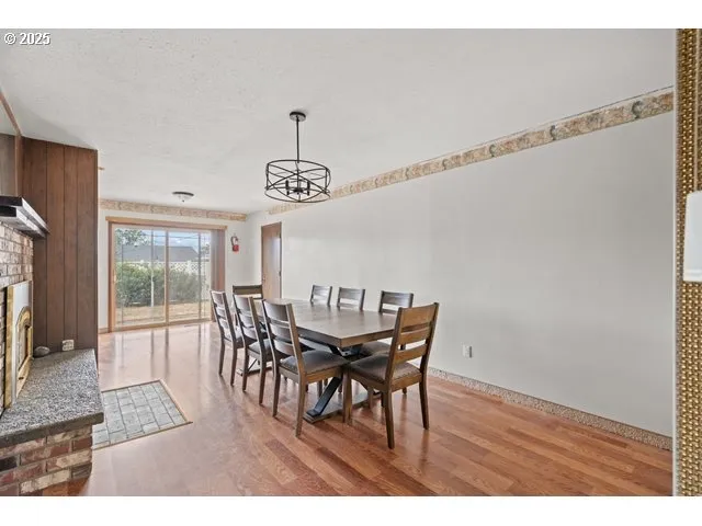 a view of a dining room with furniture and window