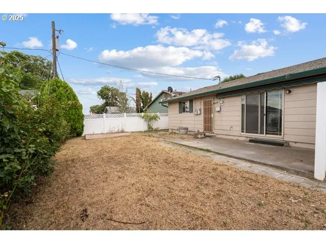 a view of a backyard of the house