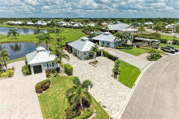 an aerial view of a house with a yard