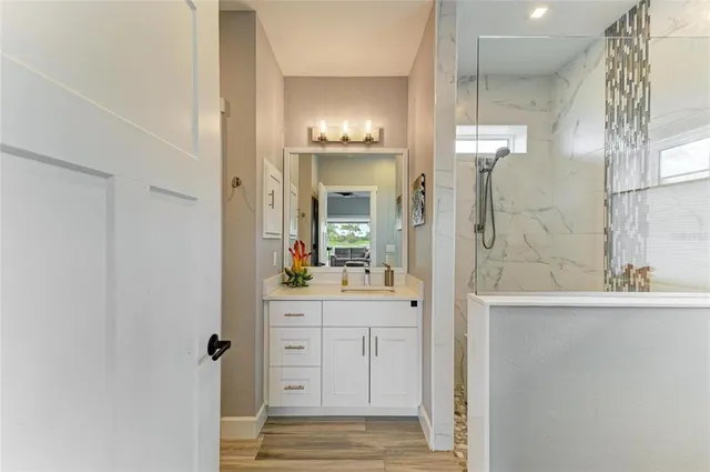 a view of a chairs and table in patio with a garden