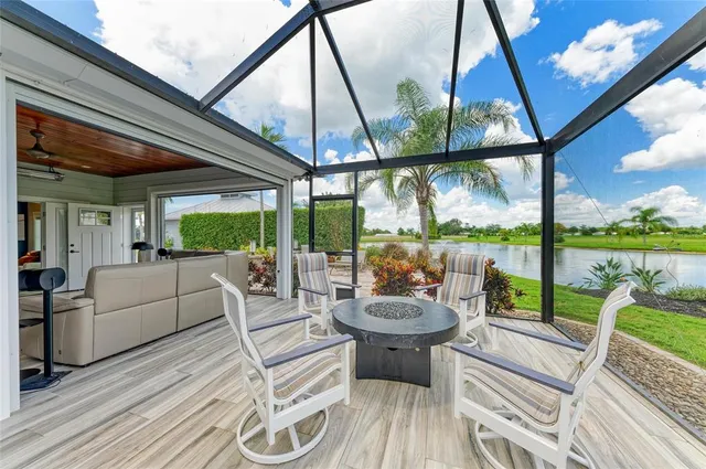 a large kitchen with stainless steel appliances kitchen island a large counter top a sink a stove and a refrigerator