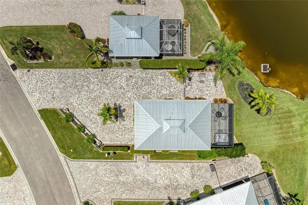 an aerial view of a house with yard swimming pool and outdoor seating
