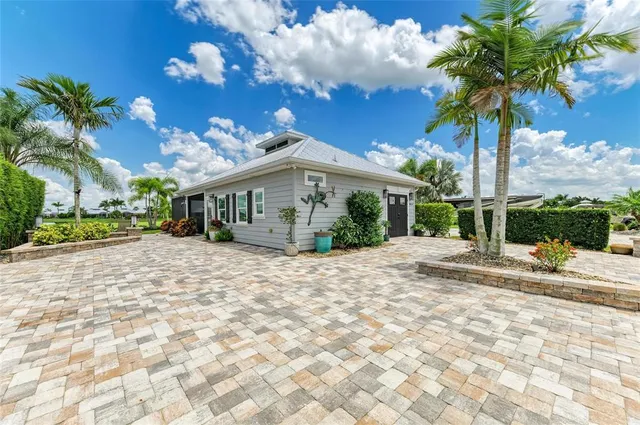 a view of house with yard and entertaining space