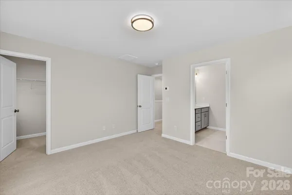 a view of a livingroom with furniture and a fan