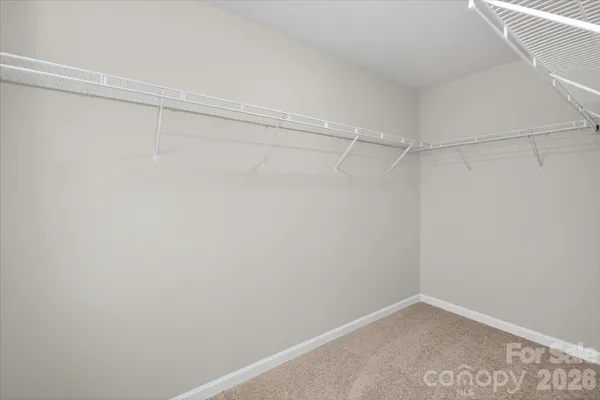 a view of a room with shelf on the wall