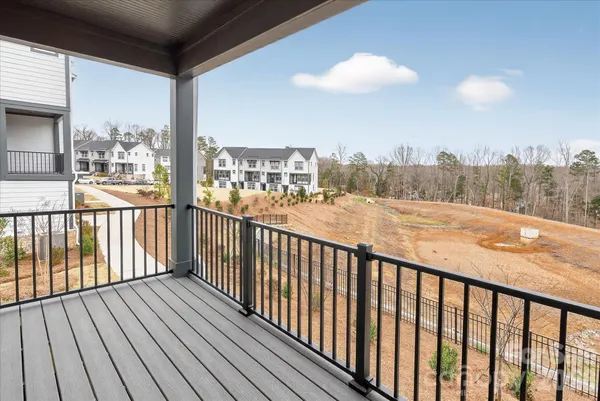 a view of a balcony with wooden floor