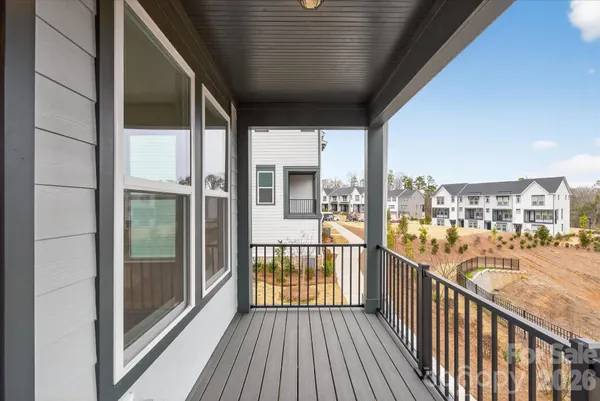 a view of balcony and yard