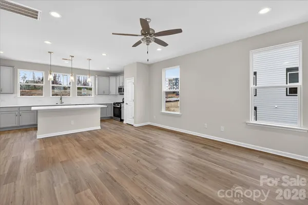 a view of a kitchen with a sink and a window