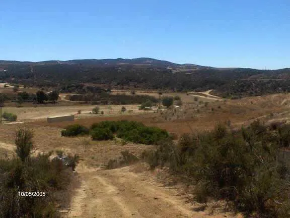 a view of a town with mountains in the background