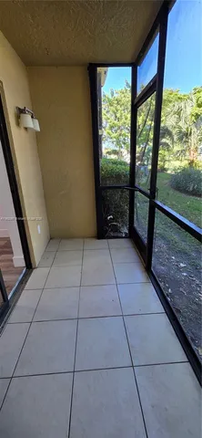 a view of a livingroom with an empty space and a fireplace