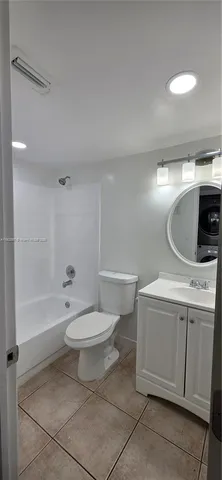a bathroom with a sink a toilet and bathtub