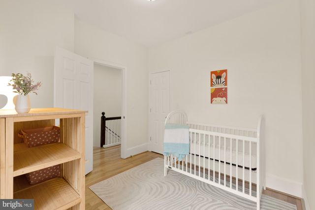 a bedroom with furniture and a chair