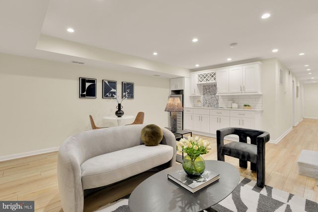 a kitchen with a sink and stove top oven