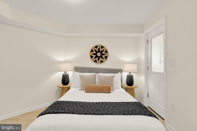 a view of a building with wooden fence