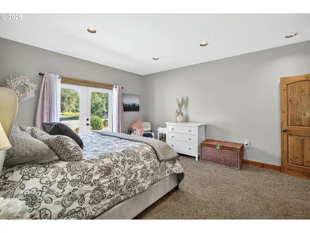 a bedroom with bed and window