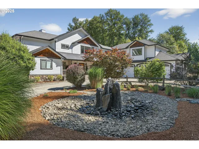 a front view of a house with garden