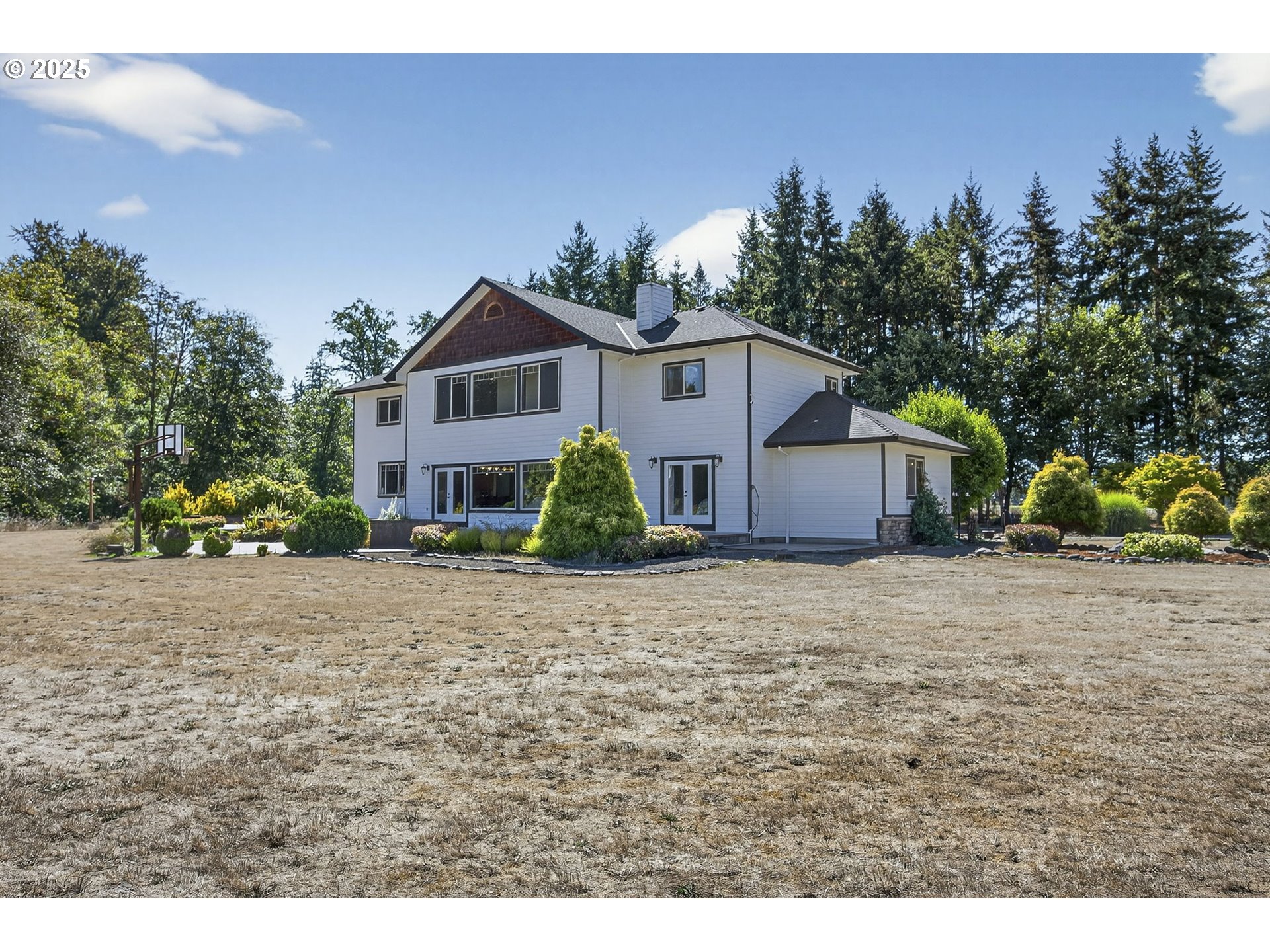 15047 South Macksburg Road Mulino, OR 97042 - Photo 7 of 48 a front view of a house with a yard and garage