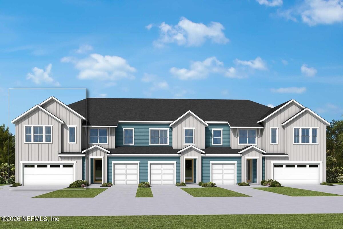 820 Bluestem Street Yulee, FL 32097 - Photo 1 of 3 a front view of residential houses with yard