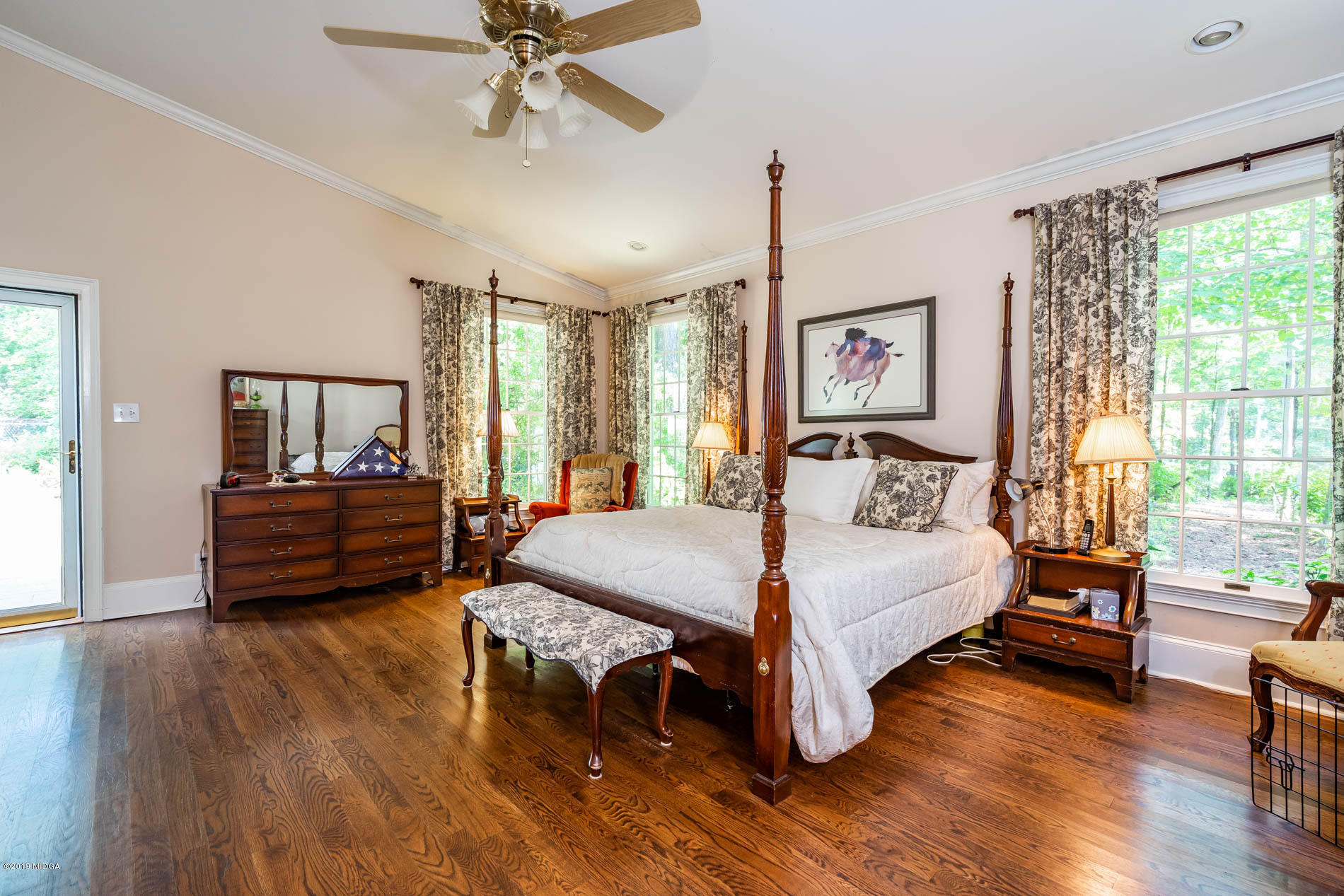 9748 Estes Road Macon, GA 31220 - Photo 34 of 144 a bedroom with a bed and wooden floor
