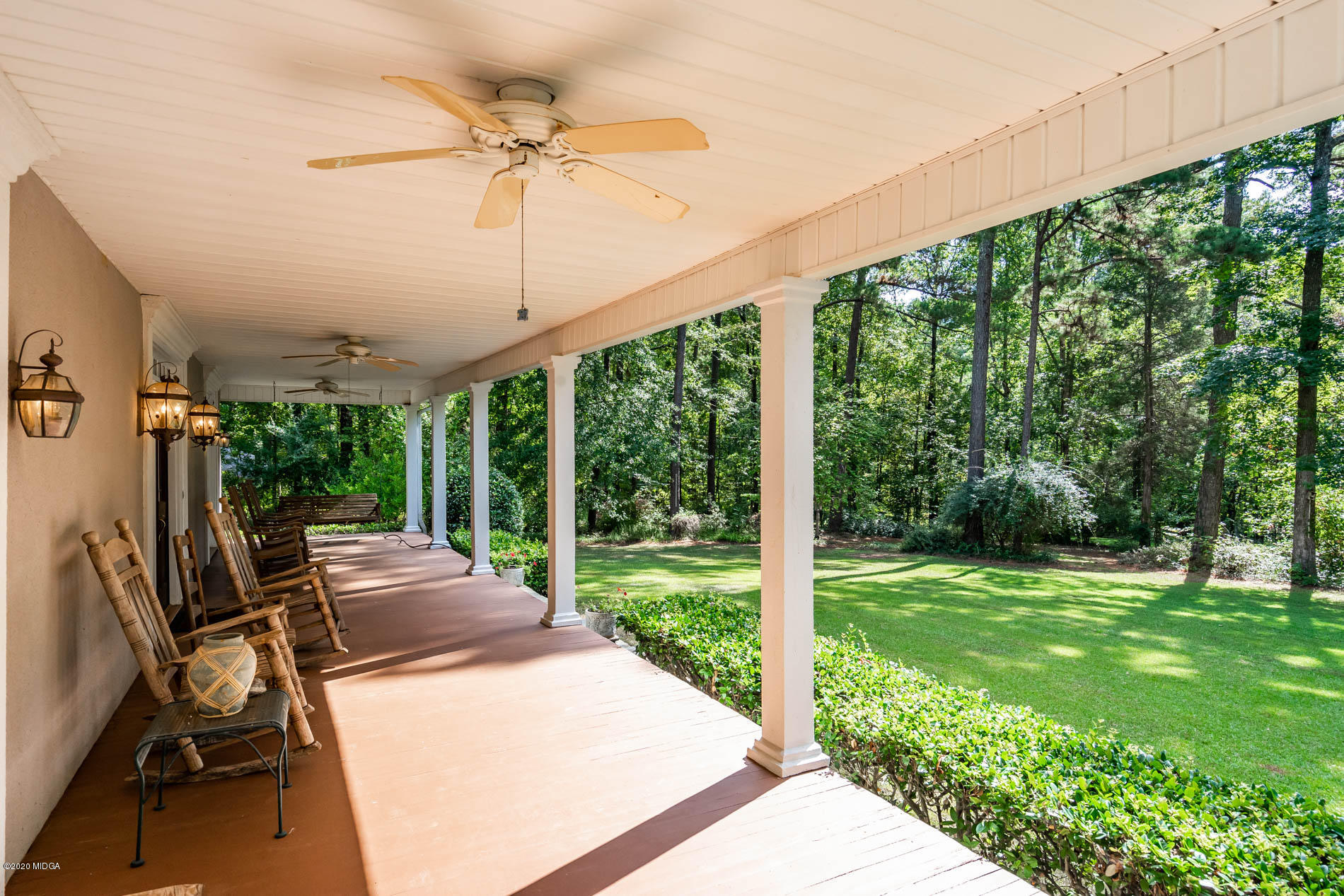 9748 Estes Road Macon, GA 31220 - Photo 77 of 144 a view of a patio with a table chairs and a yard