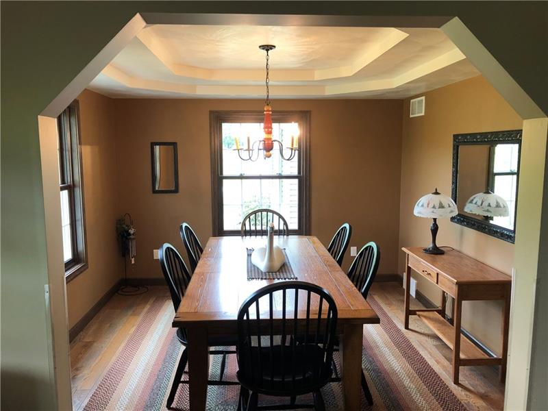 246 Burdette Road Stoneboro, PA 16153 - Photo 12 of 24 Dining room with hardwood floor and tray ceiling