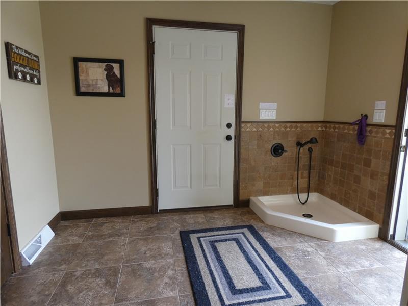 246 Burdette Road Stoneboro, PA 16153 - Photo 22 of 24 Mudroom with exterior door to the patio and a door to the attached garage. Fully equipped with a pet shower.