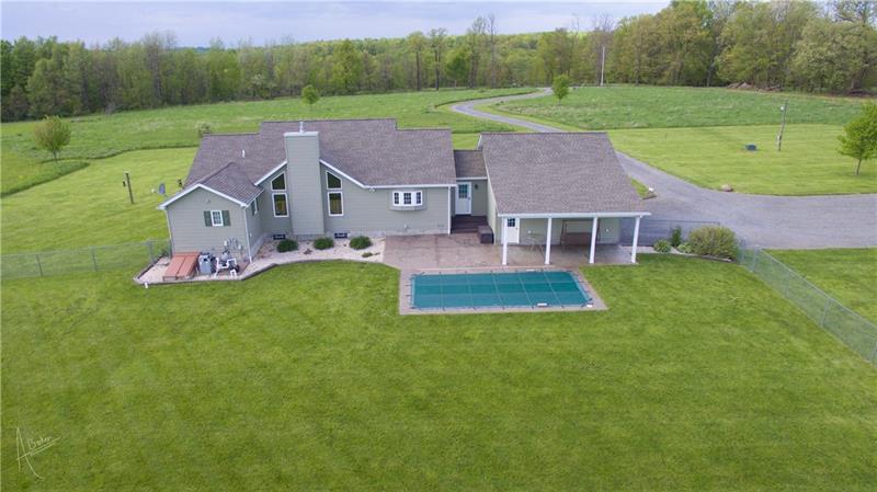 246 Burdette Road Stoneboro, PA 16153 - Photo 4 of 24 Rear view with the pool and large stamp stone covered patio.