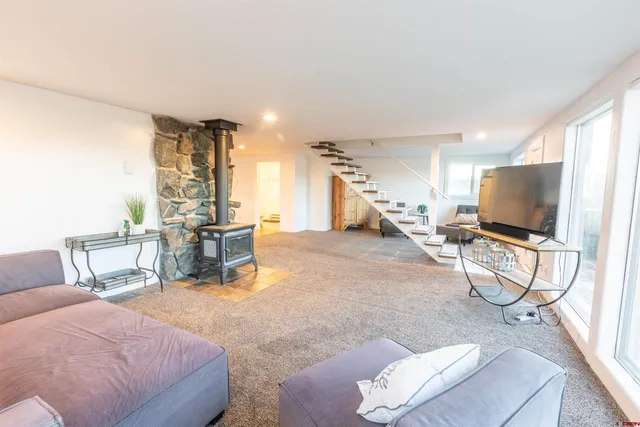 a room with furniture and a flat screen tv