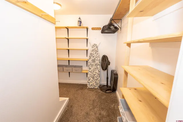 a view of storage and utility room with a sink