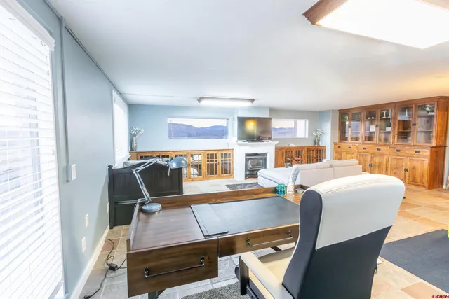 a living room with furniture and a table