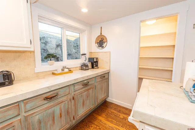 a bathroom with a sink and a window