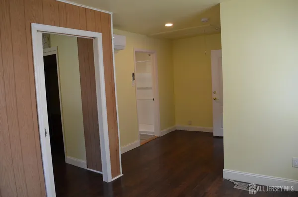 a view of entryway and wooden floor