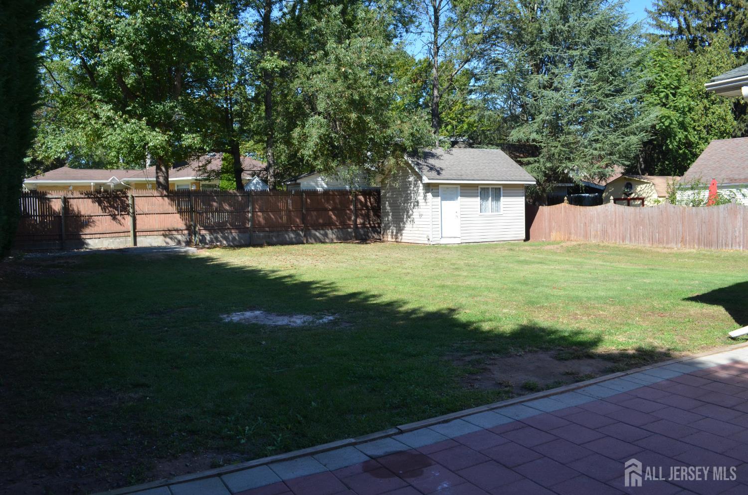 550 4th Street Dunellen, NJ 08812 - Photo 28 of 30 a view of a house with backyard and garden
