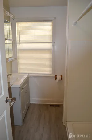 a room with a window and a washer dryer