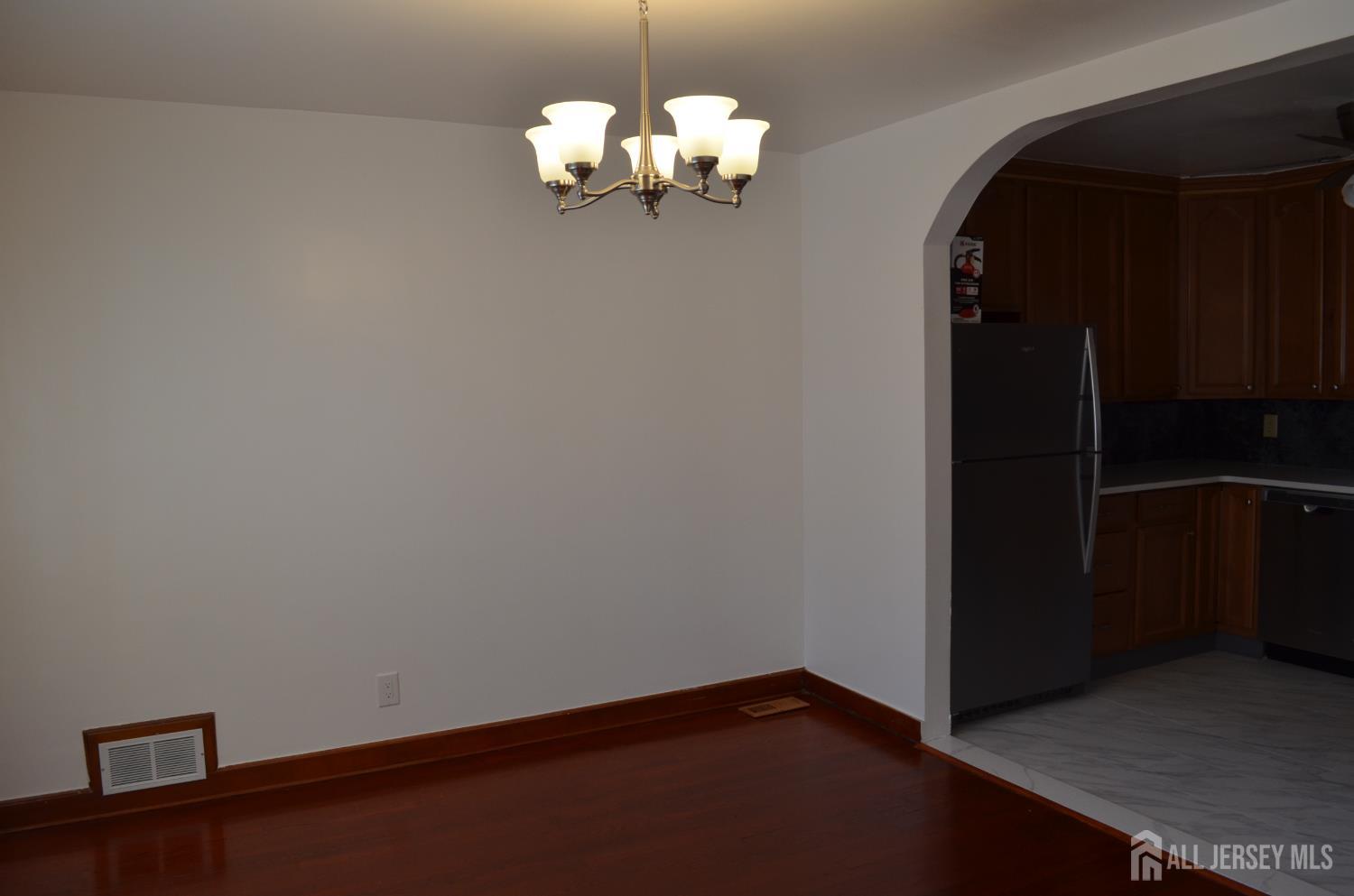 550 4th Street Dunellen, NJ 08812 - Photo 9 of 30 a view of a chandelier fan and wooden floor