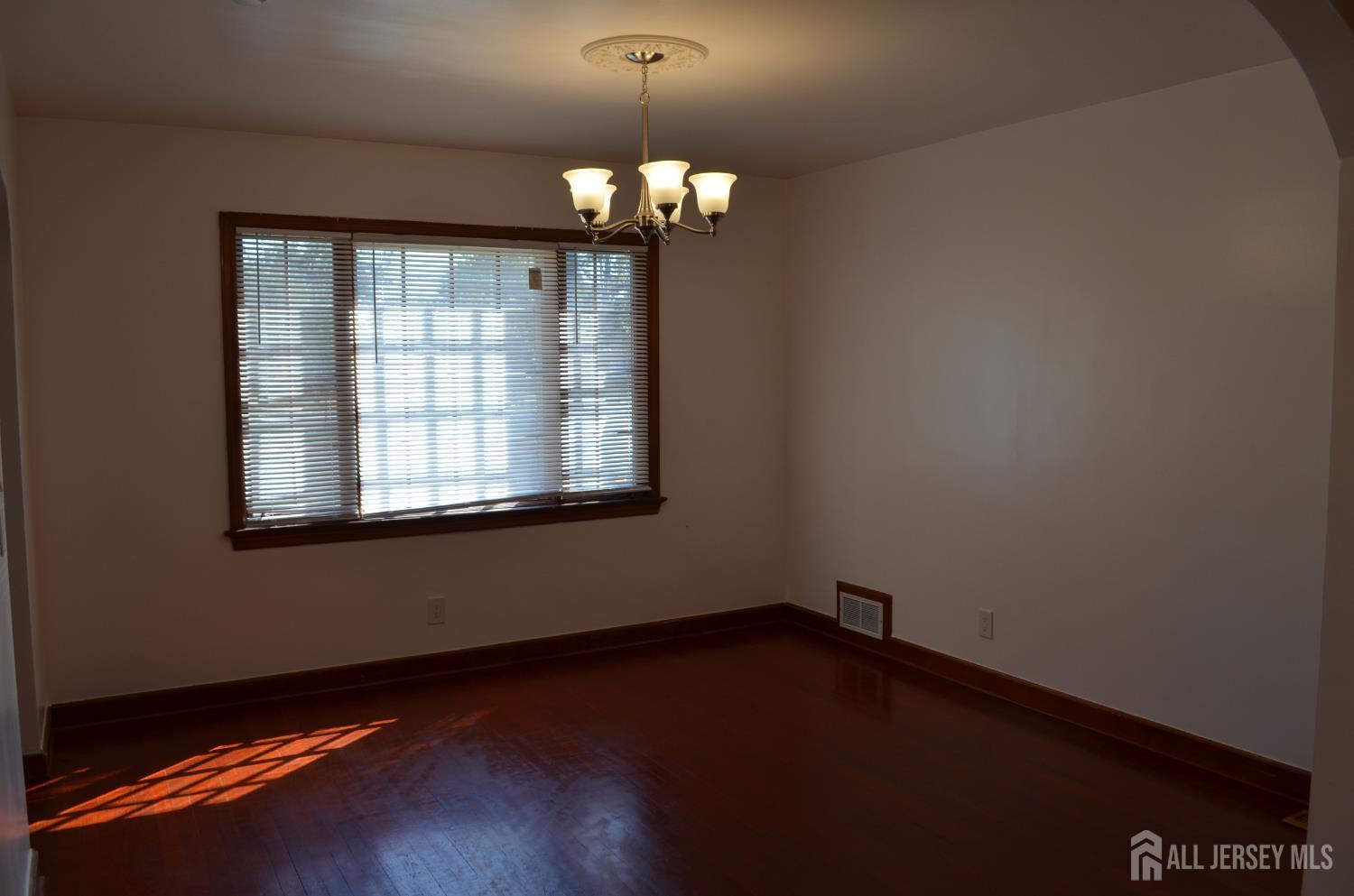 550 4th Street Dunellen, NJ 08812 - Photo 10 of 30 a view of wooden floor and a chandelier in a room