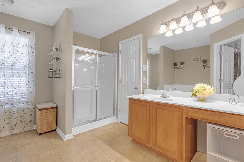 642 Lakes Circle Lithonia, GA 30058 - Photo 19 of 26 a view of kitchen with granite countertop cabinets and sink