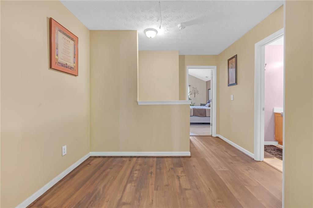642 Lakes Circle Lithonia, GA 30058 - Photo 21 of 26 a view of a room with wooden floor and a window