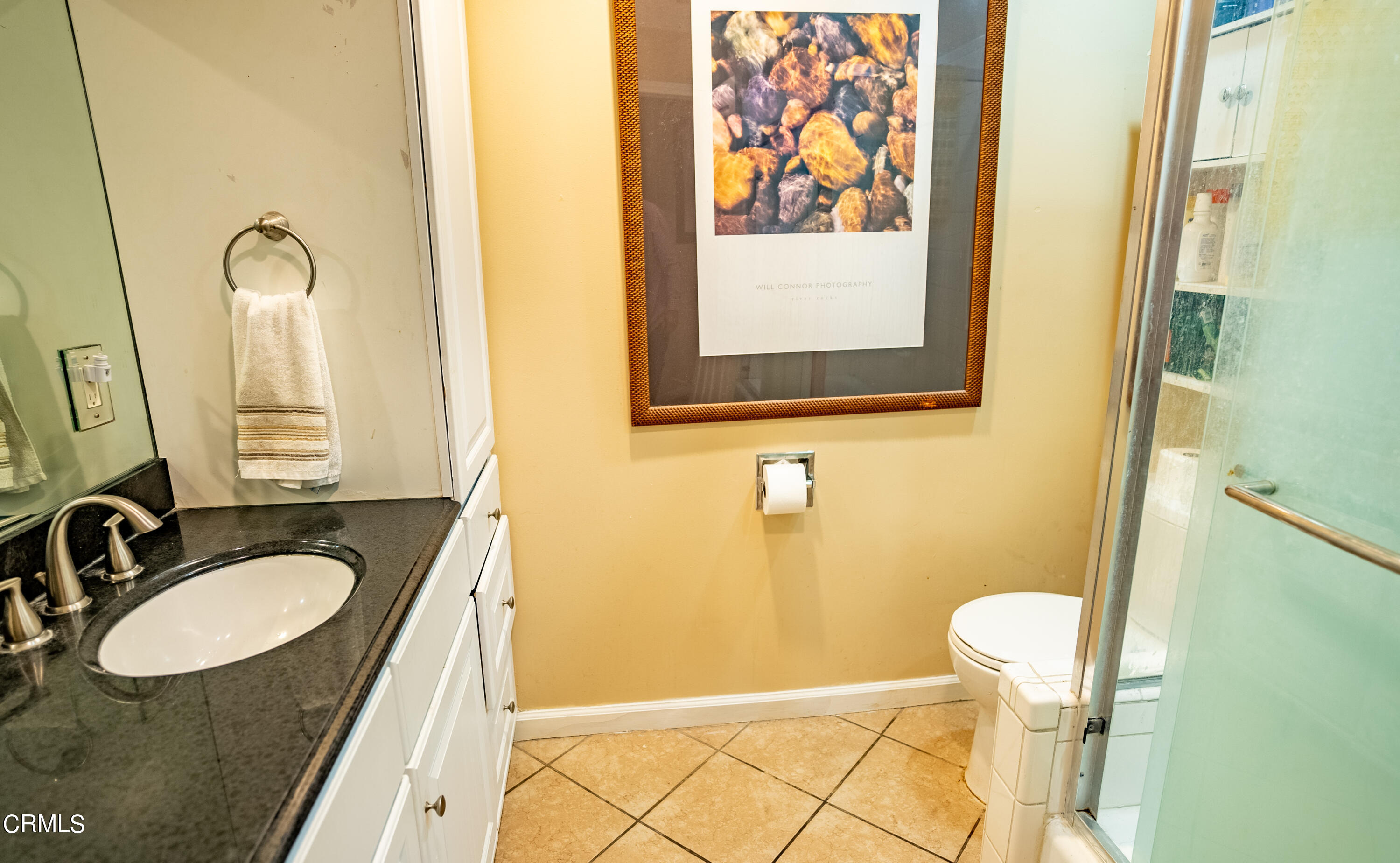 4731 Reading Drive Oxnard, CA 93033 - Photo 12 of 25 a bathroom with a granite countertop sink and a mirror