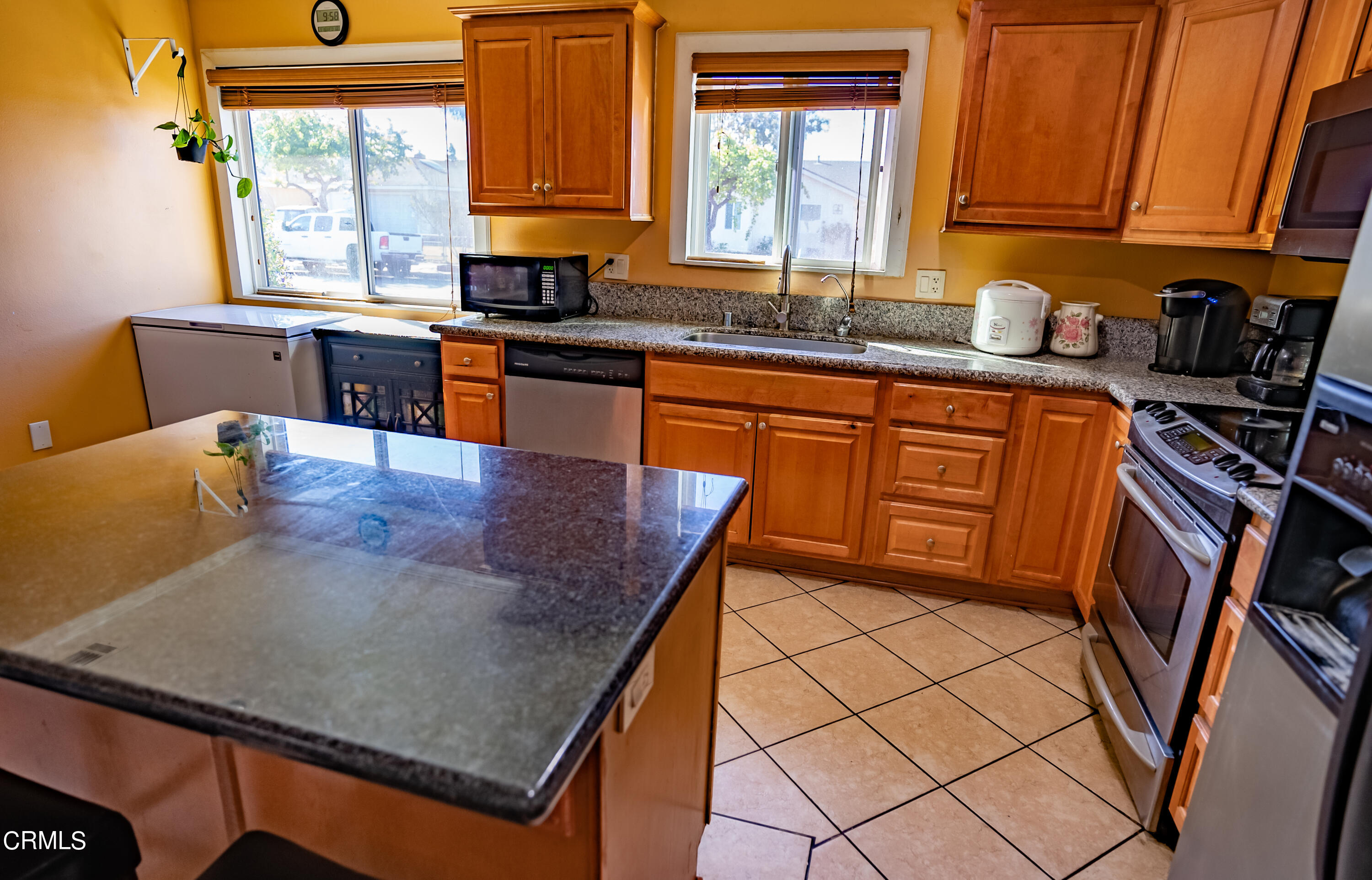 4731 Reading Drive Oxnard, CA 93033 - Photo 6 of 25 a kitchen with stainless steel appliances granite countertop a sink and a stove