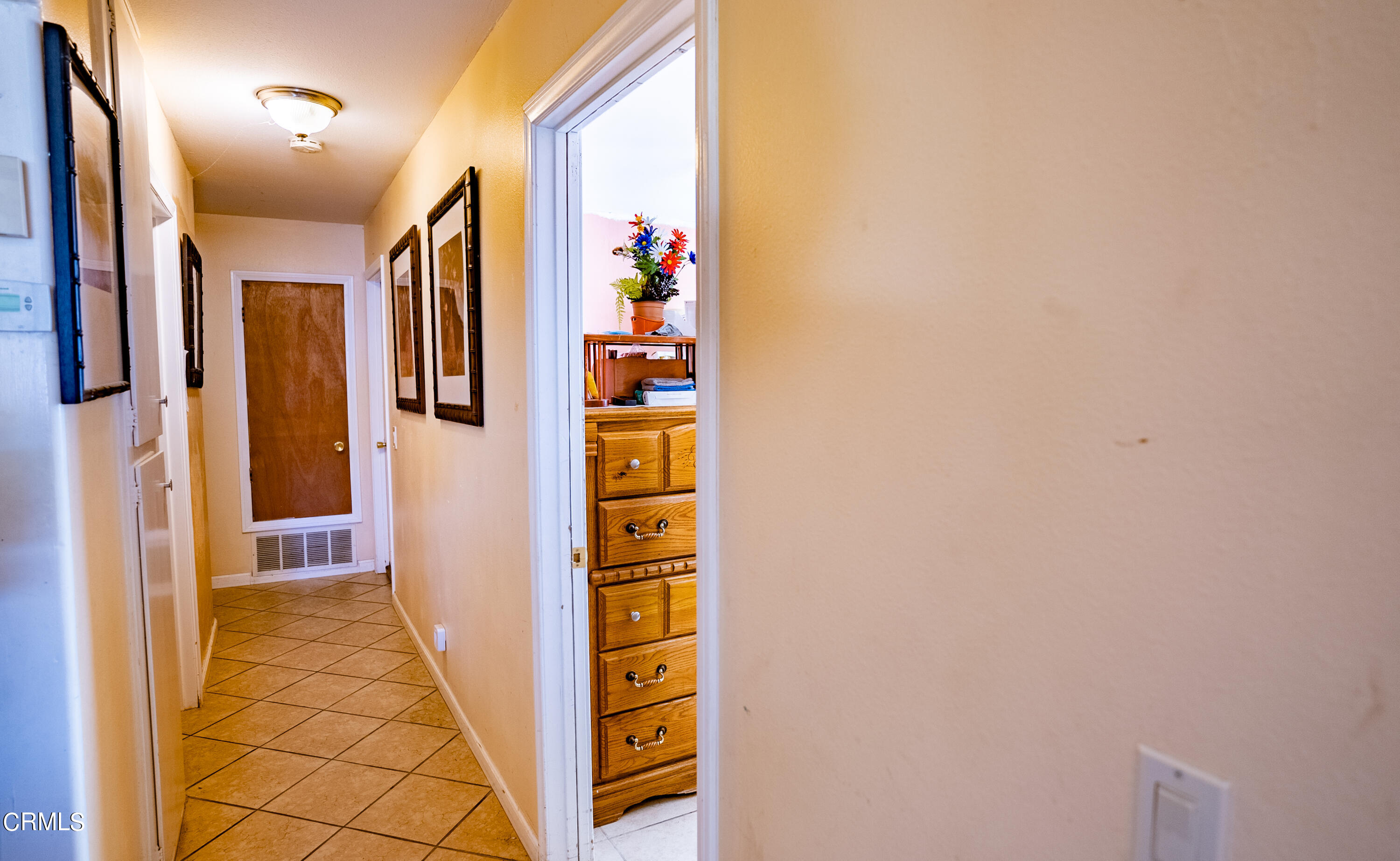 4731 Reading Drive Oxnard, CA 93033 - Photo 8 of 25 a view of a hallway with windows and painted walls