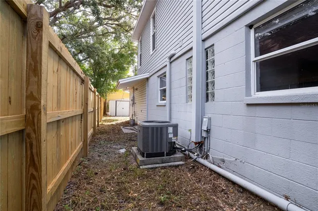 an aerial view of a house with a yard and garden