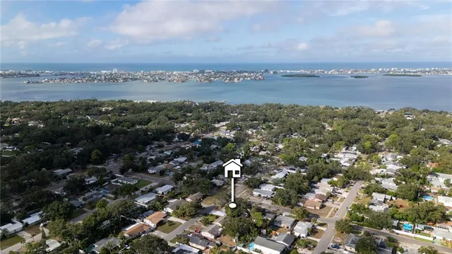 an aerial view of residential house with green space