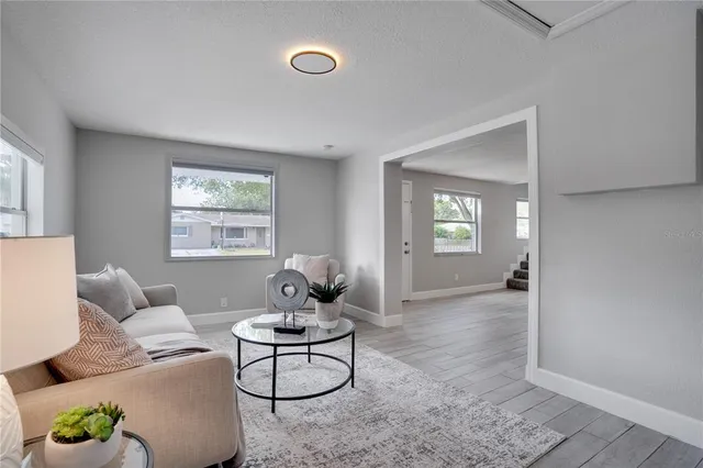 a living room with furniture and a window