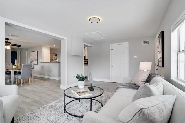 a living room with furniture and a table