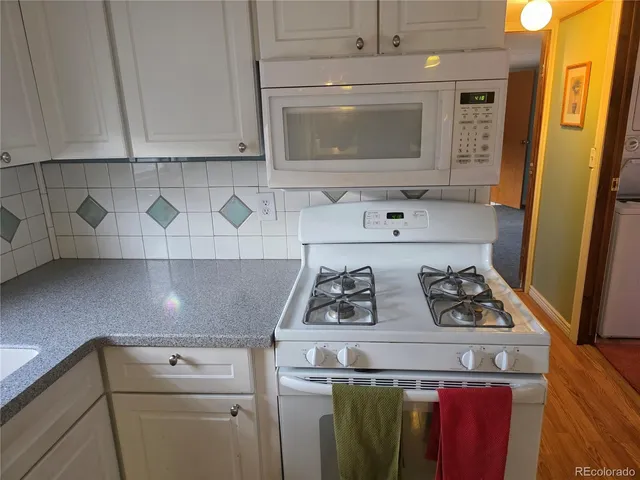 a kitchen with a stove and a microwave