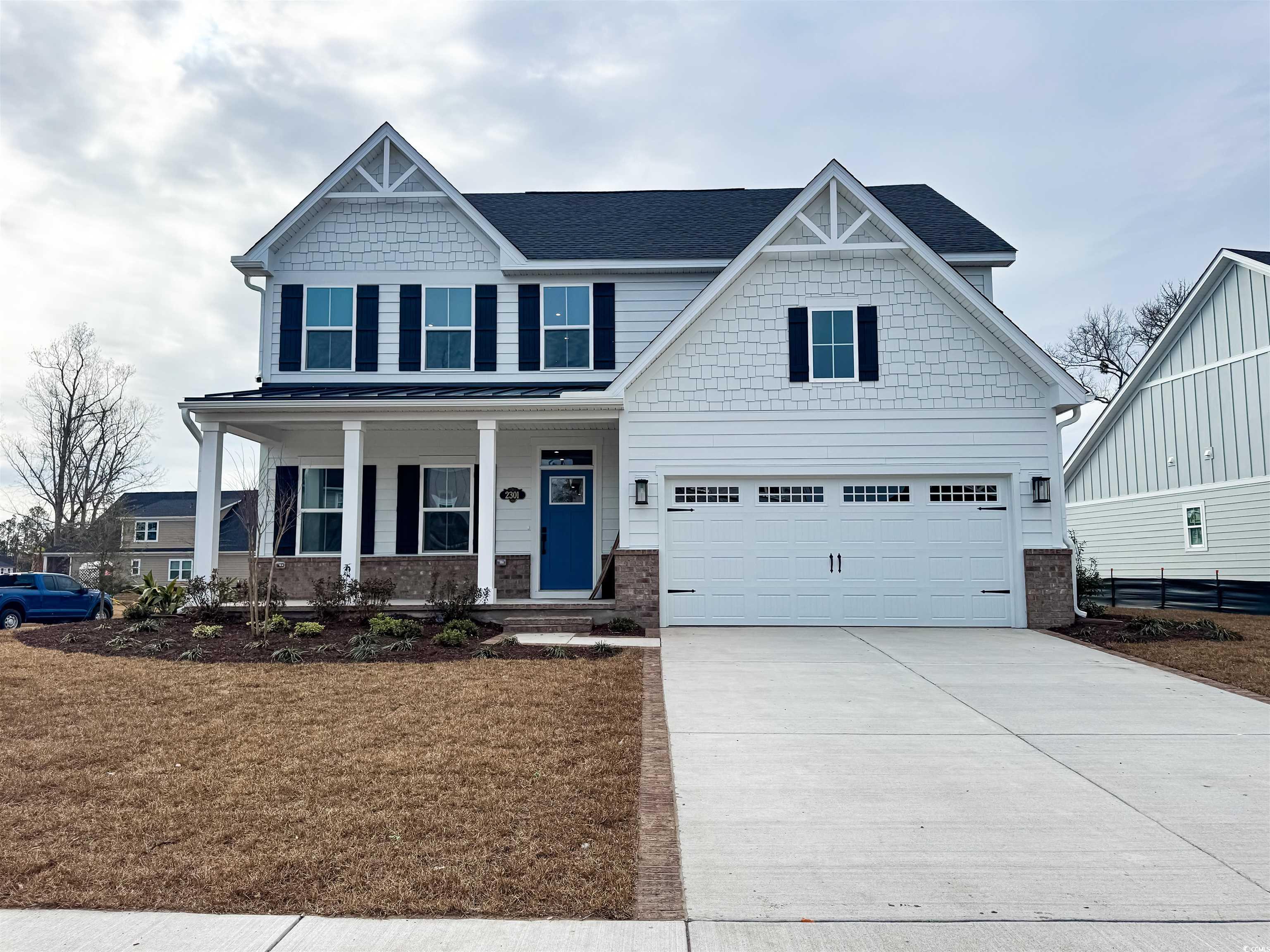 2301 Hazel Way Longs, SC 29568 - Photo 1 of 1 Craftsman-style house featuring a front yard, a po