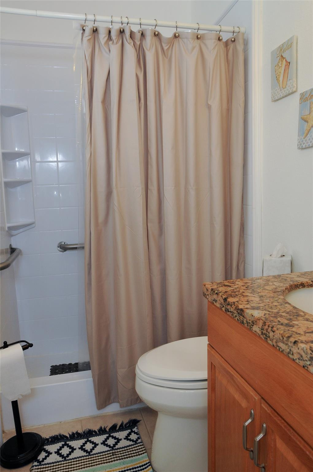 29 Northeast 3rd Street, Unit B Dania Beach, FL 33004 - Photo 15 of 18 a bathroom with a granite countertop sink and a toilet