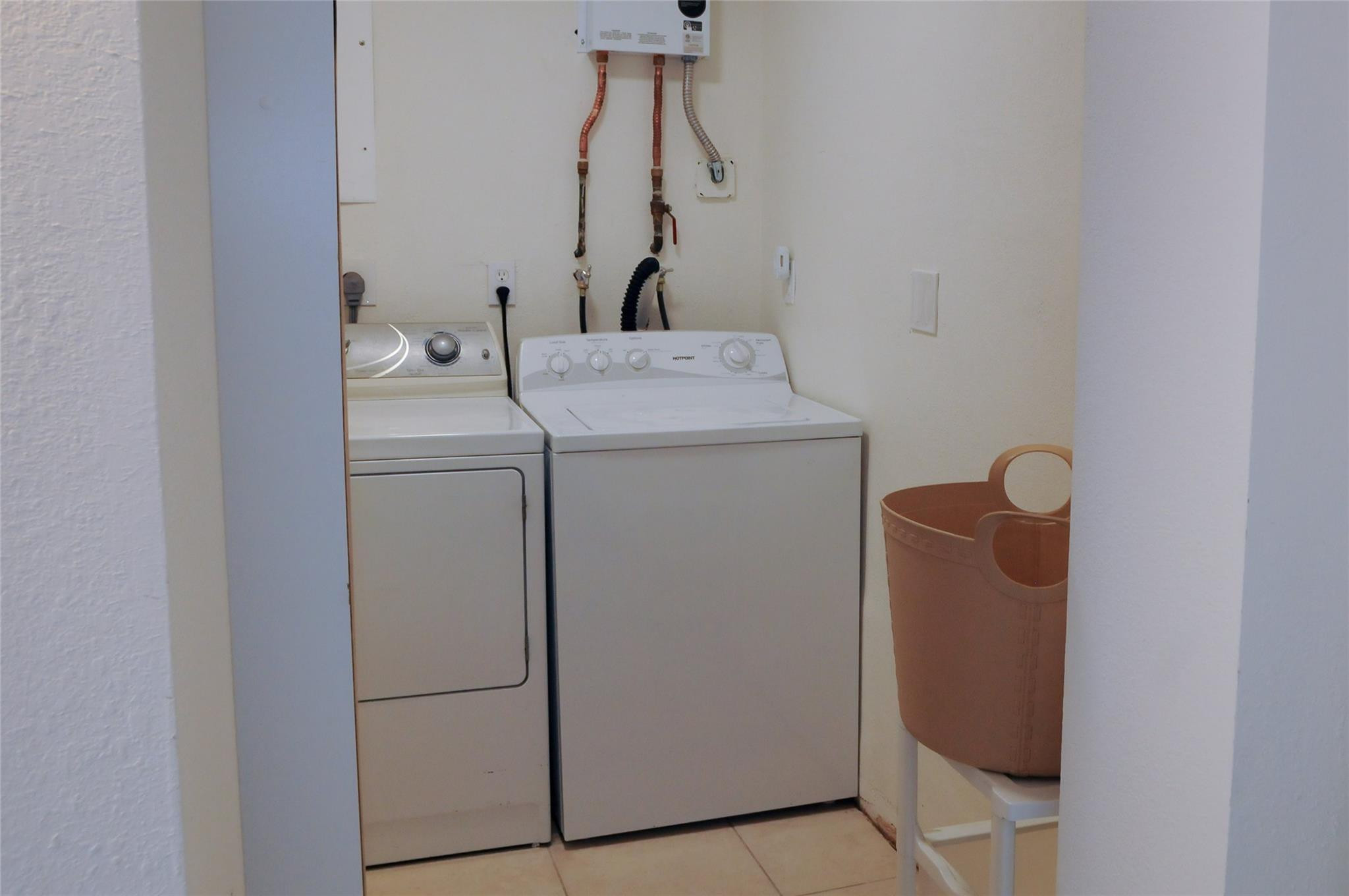 29 Northeast 3rd Street, Unit B Dania Beach, FL 33004 - Photo 18 of 18 a utility room with dryer and washer
