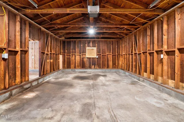 a view of an empty room with wooden walls
